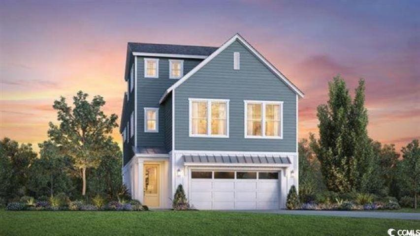 512 9th Ave S, North Myrtle Beach, SC 29582 - view of front facade with a garage and a lawn