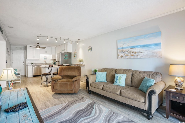 6000 N Ocean Blvd Unit 133, North Myrtle Beach, SC 29582 - living area featuring light wood finished floors and ceiling fan