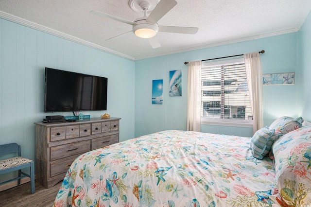 6000 N Ocean Blvd Unit 133, North Myrtle Beach, SC 29582 - bedroom with ornamental molding, wood finished floors, a textured ceiling, and ceiling fan