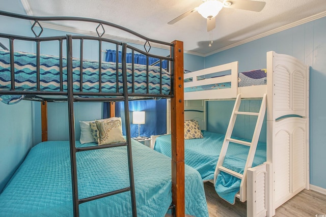 6000 N Ocean Blvd Unit 133, North Myrtle Beach, SC 29582 - bedroom featuring wood finished floors, crown molding, a textured ceiling, and a ceiling fan