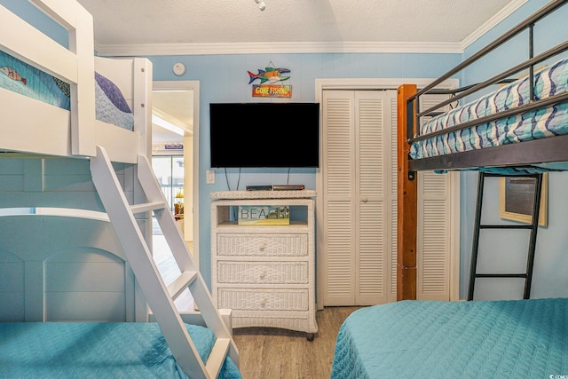 6000 N Ocean Blvd Unit 133, North Myrtle Beach, SC 29582 - bedroom with ornamental molding, a closet, and wood finished floors
