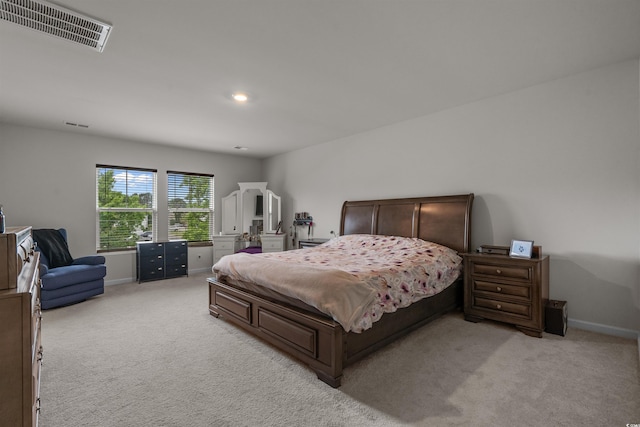 bedroom featuring light carpet, baseboards, and recessed lighting
