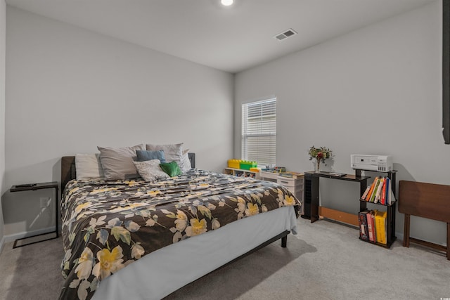 bedroom with carpet and baseboards