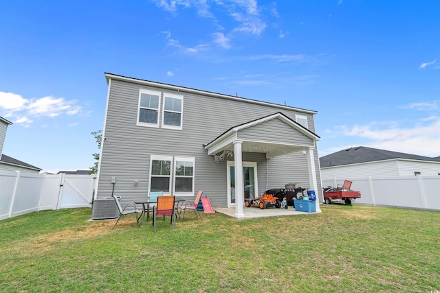 rear view of property with a gate and a patio