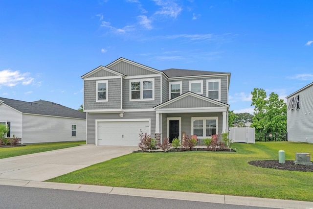 craftsman inspired home featuring an attached garage, driveway, and board and batten siding