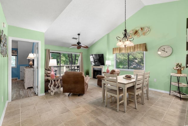 400 Melrose Pl Unit 14E, Myrtle Beach, SC 29572 - dining room featuring ceiling fan, a fireplace, a chandelier, light tile patterned floors, and baseboards