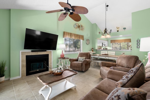400 Melrose Pl Unit 14E, Myrtle Beach, SC 29572 - living area with high vaulted ceiling, ceiling fan, a fireplace, light tile patterned floors, and baseboards