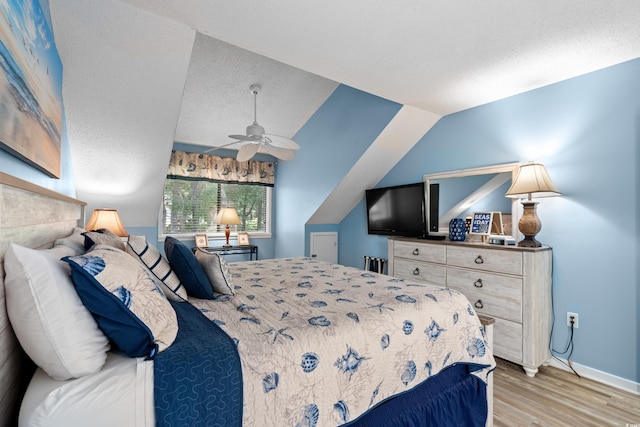 400 Melrose Pl Unit 14E, Myrtle Beach, SC 29572 - bedroom featuring wood finished floors, baseboards, and lofted ceiling