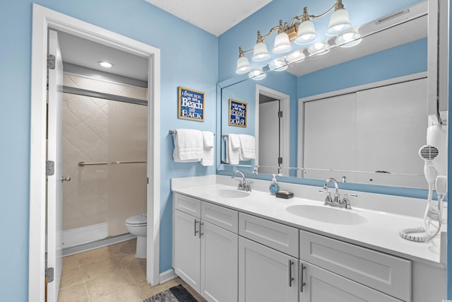 400 Melrose Pl Unit 14E, Myrtle Beach, SC 29572 - bathroom with a stall shower, double vanity, toilet, and tile patterned flooring