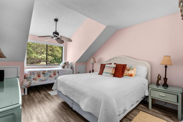 400 Melrose Pl Unit 14E, Myrtle Beach, SC 29572 - bedroom with wood finished floors, a textured ceiling, ceiling fan, and lofted ceiling