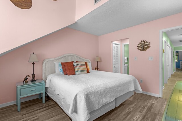 400 Melrose Pl Unit 14E, Myrtle Beach, SC 29572 - bedroom with wood finished floors and baseboards