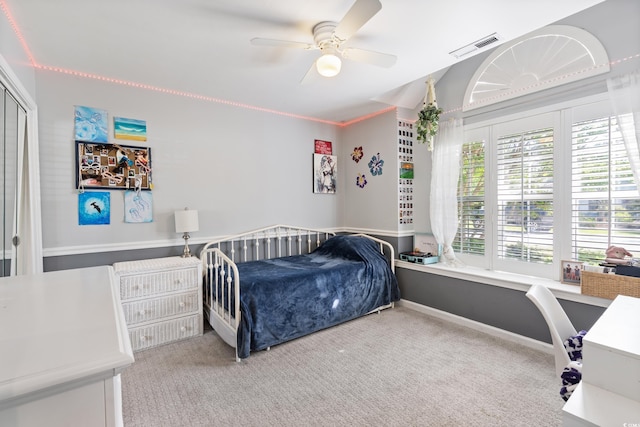 bedroom with carpet floors and a ceiling fan