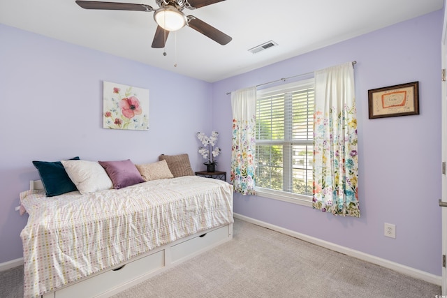 carpeted bedroom with baseboards and a ceiling fan