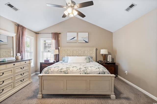 carpeted bedroom featuring lofted ceiling, baseboards, and a ceiling fan