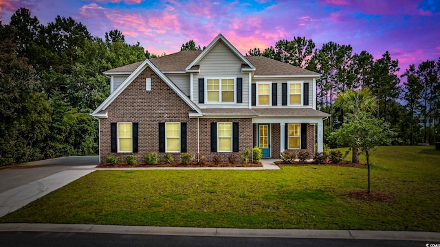 1303 Bermuda Grass Dr, Myrtle Beach, SC 29579 - view of front of property featuring a front yard, roof with shingles, and brick siding