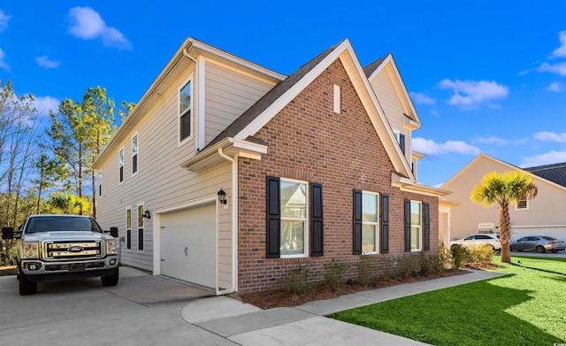 1303 Bermuda Grass Dr, Myrtle Beach, SC 29579 - view of home's exterior featuring brick siding, an attached garage, driveway, and a lawn