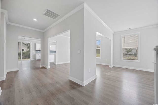 1303 Bermuda Grass Dr, Myrtle Beach, SC 29579 - unfurnished living room featuring ornamental molding, wood finished floors, baseboards, and recessed lighting