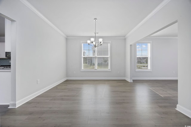 1303 Bermuda Grass Dr, Myrtle Beach, SC 29579 - unfurnished dining area with a chandelier, wood finished floors, crown molding, and baseboards