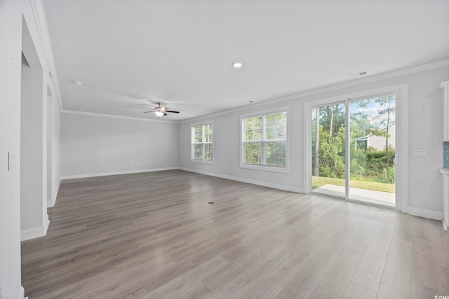 1303 Bermuda Grass Dr, Myrtle Beach, SC 29579 - unfurnished living room with ornamental molding, baseboards, ceiling fan, and light wood-style flooring