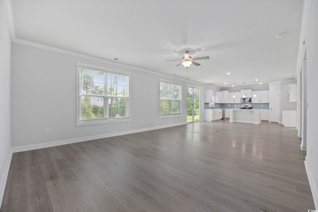 1303 Bermuda Grass Dr, Myrtle Beach, SC 29579 - unfurnished living room with a ceiling fan, ornamental molding, recessed lighting, wood finished floors, and baseboards
