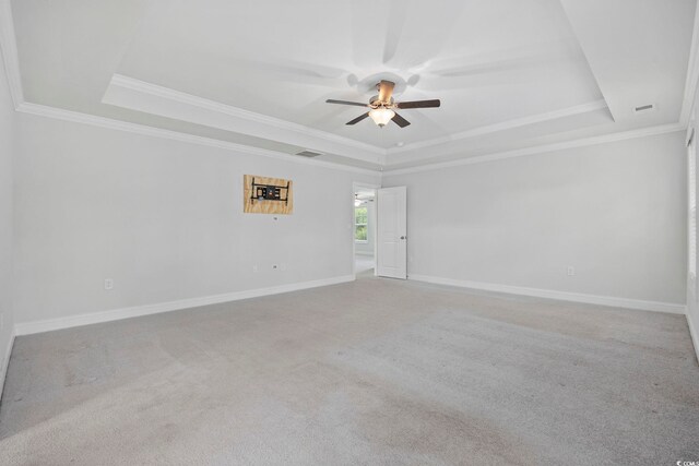 1303 Bermuda Grass Dr, Myrtle Beach, SC 29579 - unfurnished room with a raised ceiling, ceiling fan, crown molding, baseboards, and carpet flooring