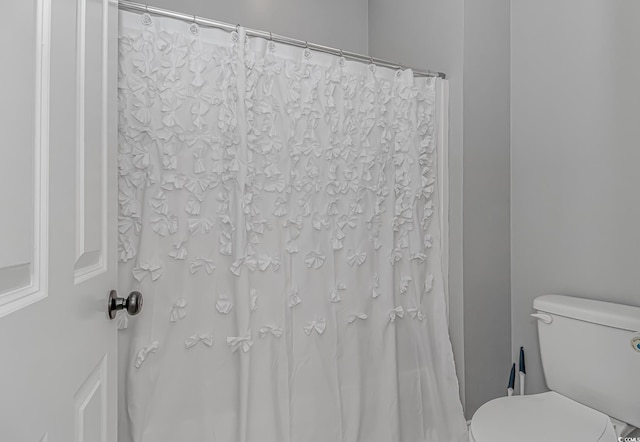 212 Greenwich Dr, Conway, SC 29526 - bathroom featuring toilet and a shower with shower curtain