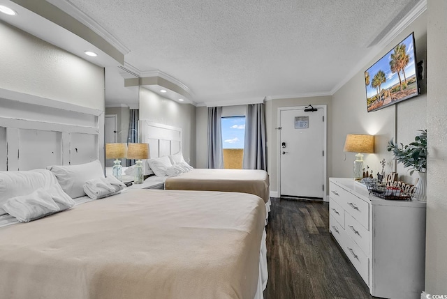 6900 N Ocean Blvd Unit 1437, Myrtle Beach, SC 29572 - bedroom featuring a textured ceiling, ornamental molding, dark wood-type flooring, and recessed lighting