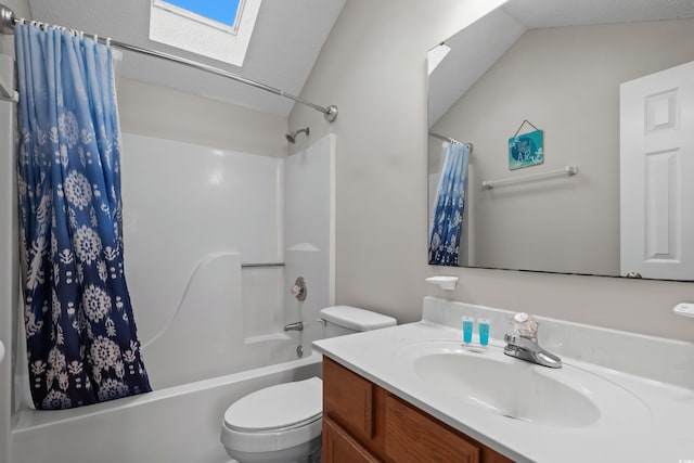 full bathroom featuring a skylight, toilet, vanity, and shower / tub combo