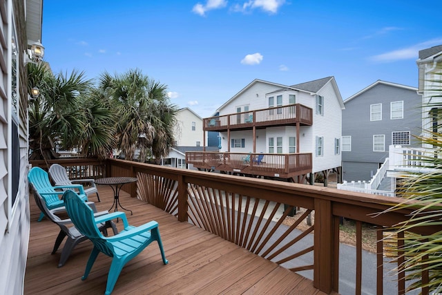 wooden deck with a residential view