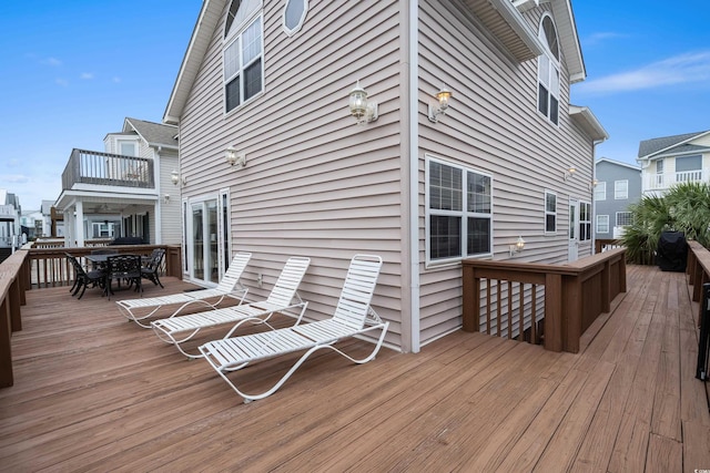 wooden deck with outdoor dining space