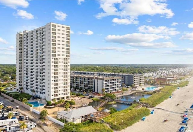 aerial view of a large body of water and apartment complex