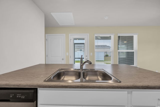 478 Samara Dr, Longs, SC 29568 - kitchen with a sink, dishwashing machine, and white cabinetry
