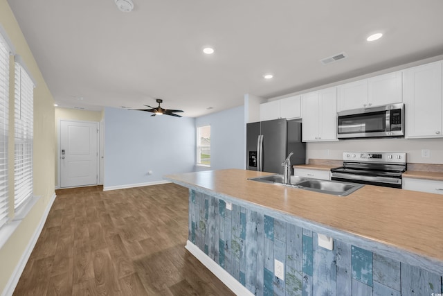 478 Samara Dr, Longs, SC 29568 - kitchen featuring stainless steel appliances, a sink, baseboards, white cabinets, and recessed lighting