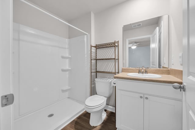 478 Samara Dr, Longs, SC 29568 - bathroom featuring a ceiling fan, toilet, a shower, wood finished floors, and vanity