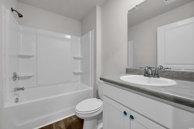 478 Samara Dr, Longs, SC 29568 - full bathroom featuring toilet, vanity, wood finished floors, and washtub / shower combination