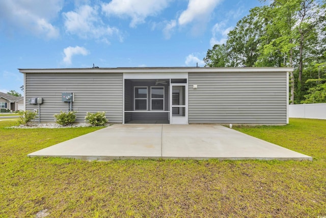 478 Samara Dr, Longs, SC 29568 - back of house featuring a patio, a lawn, and a sunroom