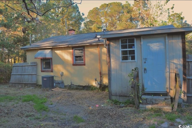 414 E Wine St, Mullins, SC 29574 - outdoor structure at dusk featuring central AC unit and an outdoor structure