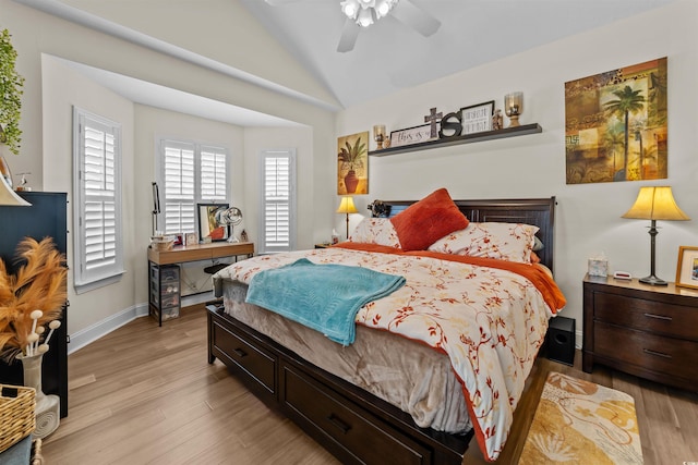 bedroom with lofted ceiling, light wood finished floors, ceiling fan, and baseboards