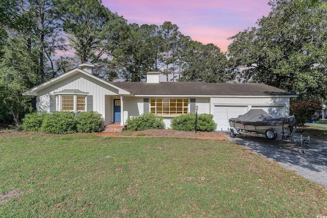 2604 S Bay St, Georgetown, SC 29440 - single story home with a garage, driveway, a front lawn, a chimney, and brick siding