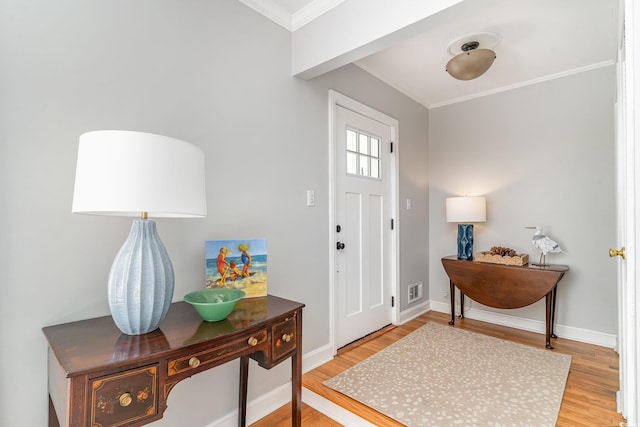 2604 S Bay St, Georgetown, SC 29440 - entryway featuring ornamental molding, light wood-style floors, and baseboards