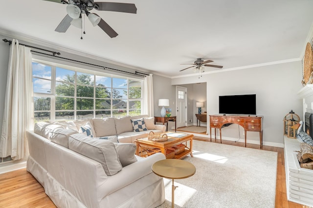 2604 S Bay St, Georgetown, SC 29440 - living area with a ceiling fan, light wood-style flooring, crown molding, and baseboards