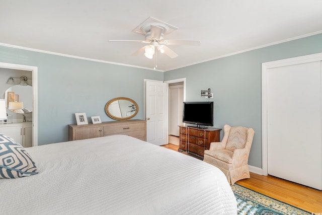 2604 S Bay St, Georgetown, SC 29440 - bedroom with light wood-type flooring, crown molding, ceiling fan, and baseboards