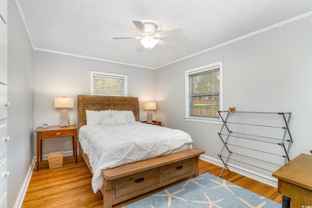 2604 S Bay St, Georgetown, SC 29440 - bedroom featuring light wood finished floors, baseboards, crown molding, and a ceiling fan