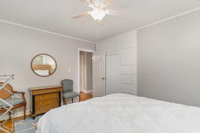 2604 S Bay St, Georgetown, SC 29440 - bedroom featuring wood finished floors, ornamental molding, baseboards, and a ceiling fan