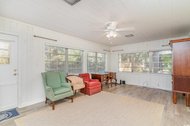2604 S Bay St, Georgetown, SC 29440 - living area with a ceiling fan, wood finished floors, healthy amount of natural light, wood walls, and wooden ceiling