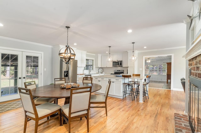 2604 S Bay St, Georgetown, SC 29440 - dining area with crown molding, french doors, recessed lighting, light wood-style flooring, and baseboards