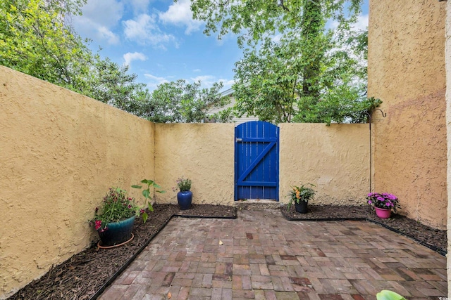 view of patio / terrace with a gate and a fenced backyard
