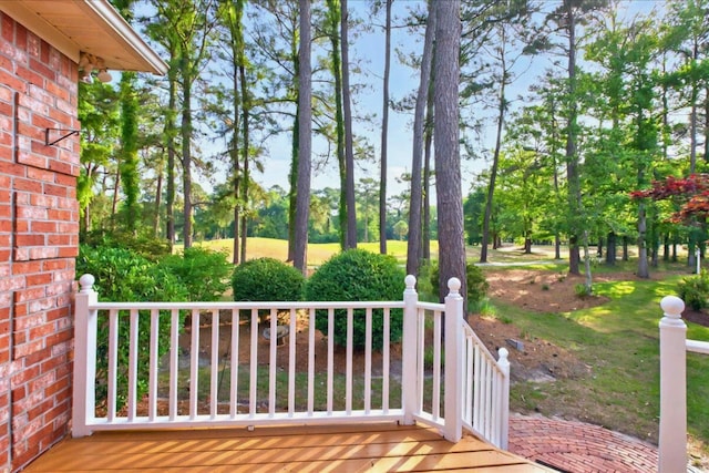 154 Windsor Cir SW, Ocean Isle Beach, NC 28469 - wooden deck with view of wooded area