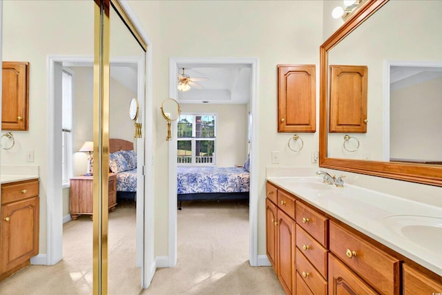 154 Windsor Cir SW, Ocean Isle Beach, NC 28469 - ensuite bathroom with double vanity and a ceiling fan