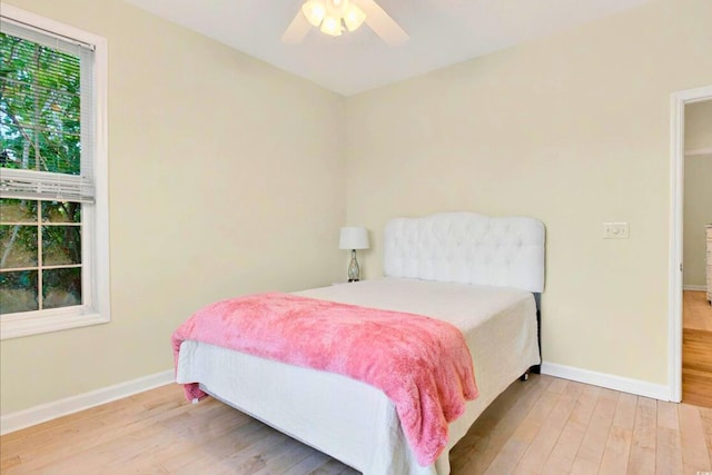 154 Windsor Cir SW, Ocean Isle Beach, NC 28469 - bedroom featuring wood finished floors, baseboards, and a ceiling fan